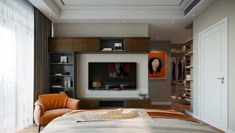 Kệ trang trí, kệ tivi, kệ ốp tường liền mạch tạo nên không gian phòng ngủ gọn gàng khoa học, đẹp mắt. Thiết kế chung cư